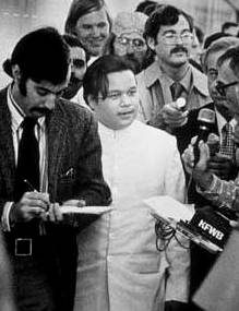 Maharaji is greeted by the press, 1970's