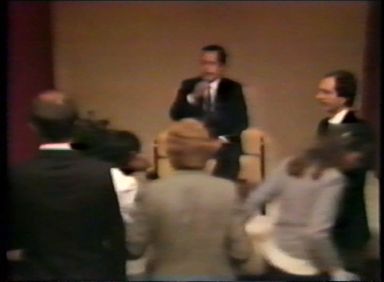 A line of people kissing Prem Rawat's feet