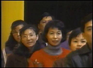 A line of people kissing Prem Rawat's feet