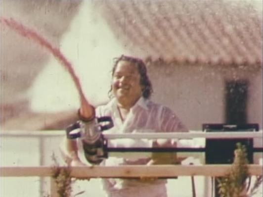 Click to See Larger Image of Prem Rawat (Maharaji) Showering His Devotees With Coloured Water From Giant Water Pistol Prem Rawat Inspirational Speaker Showering His Devotees With Coloured Water From Giant Water Pistol