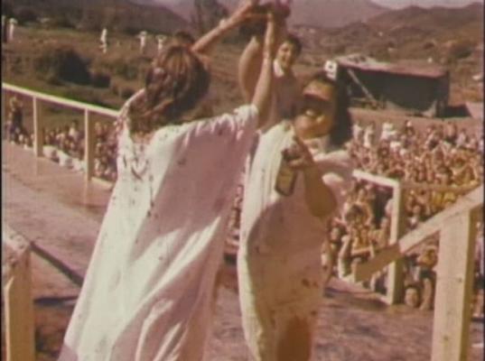 Click to See Larger Image of Rawat's Wife OutWrestling Him Rawat's Wife OutWrestling Him